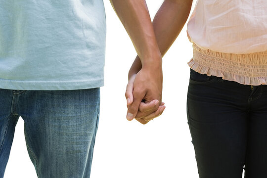 Young couple holding hands in the park