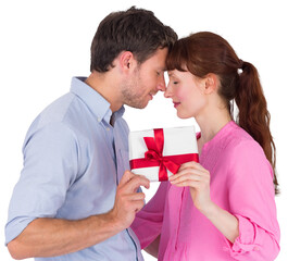 Loving couple holding a gift