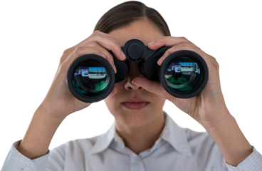 Close up of businesswoman looking through binoculars