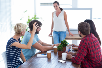 Attentive colleague asking a question in a meeting