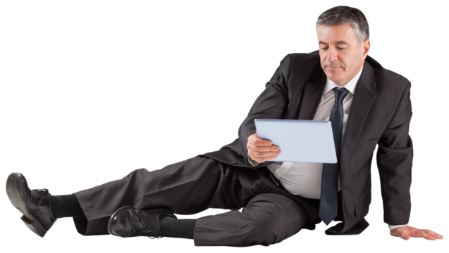 Mature businessman sitting using tablet