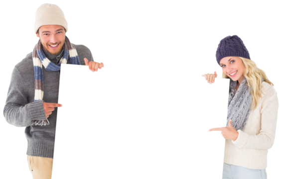 Attractive couple in winter fashion showing poster - Powered by Adobe