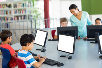 Children using computers as teacher teaching them