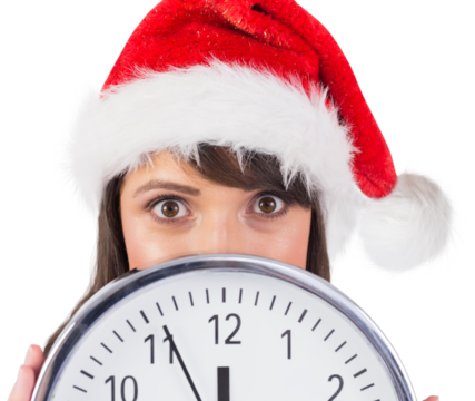 Portrait of a festive brunette holding a clock