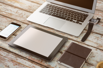 Composite image of laptop smartphone tablet notebook and watch