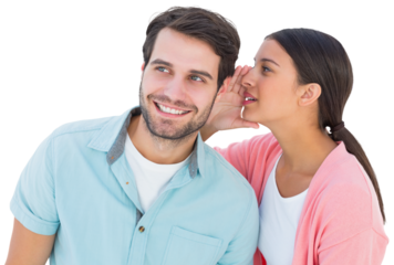 Brunette whispering secret to her boyfriend