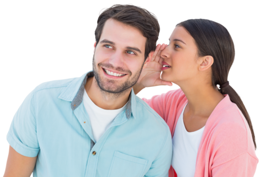 Brunette whispering secret to her boyfriend