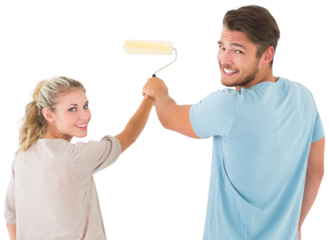Young couple painting with roller