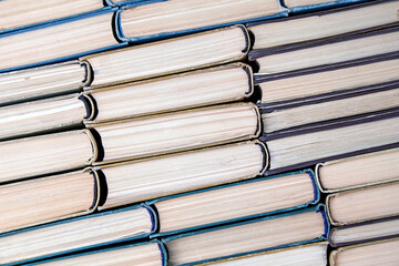 Old dilapidated books lie upside down diagonally. High-quality background for the layout