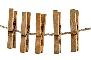 Group of old shabby wooden clothespins hanging on a clothesline