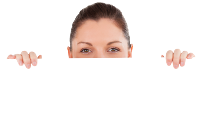 Portrait of a beautiful woman posing behind a billboard while standing