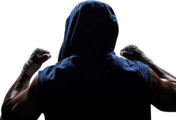 Rear view of athlete with arms raised