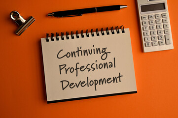 There is a notebook with the word Continuing Professional Development. It is eye-catching image.