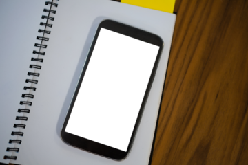 Mobile phone with note pad with phone on table