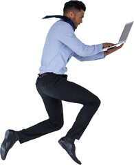 Businessman using laptop while jumping