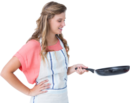 Happy hipster woman holding frying pan 