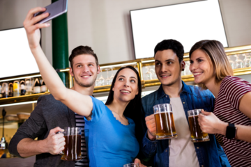 Friends taking selfie in restaurant