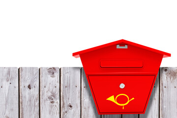 Post box on wooden fence