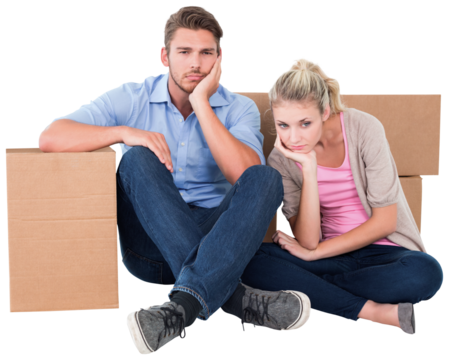 Unhappy young couple sitting beside moving boxes