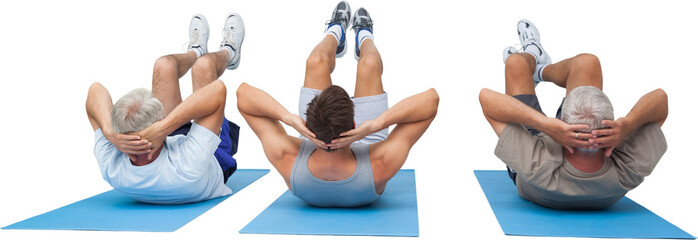 Full length of three men doing abdominal crunches