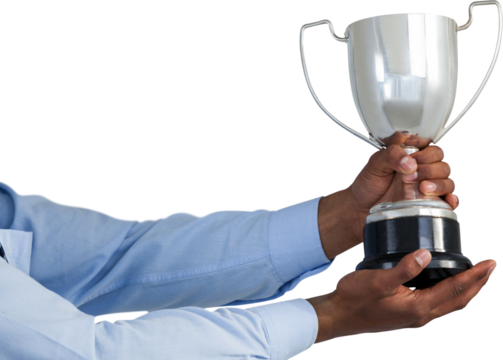 Mid section of businessman showing silver trophy  - Powered by Adobe