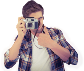 Hipster showing thumbs up while photographing