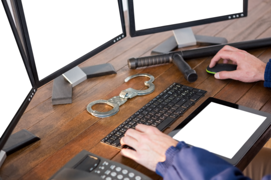 Hands of security officer using computer