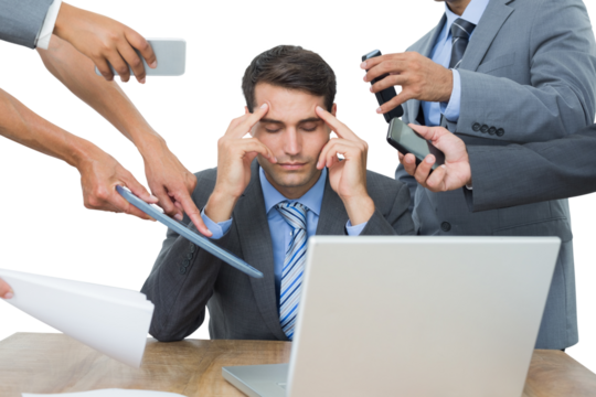 Upset businessman with headache surrounded by team