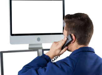 Security officer talking on telephone while looking at computer monitors