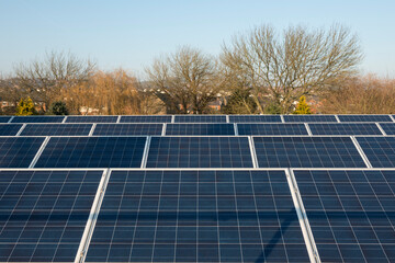 Photovoltaic solar panels on a factory roof.