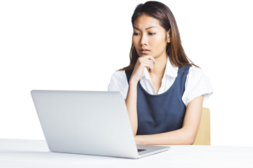 Doubtful businesswoman using a laptop