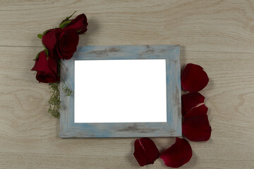 Fototapeta premium Photo frame and rose flower