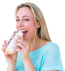 Smiling blonde eating sandwich and looking at camera 