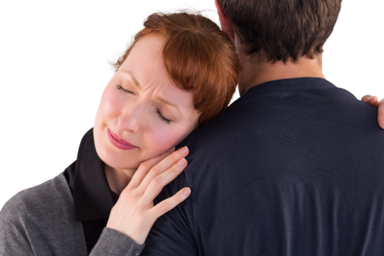 Scared woman holding onto man