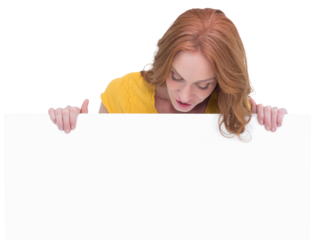 Pretty redhead showing a poster