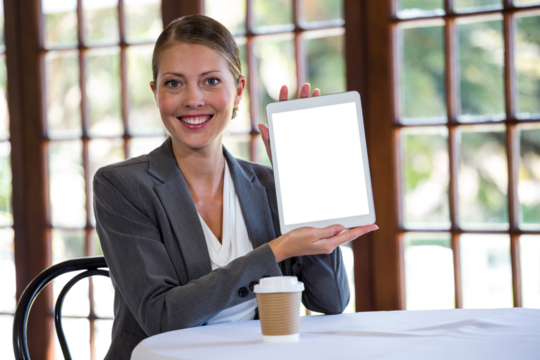 Businesswoman showing digital tablet - Powered by Adobe