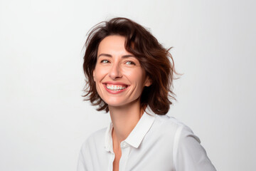 Smiling happy woman in her 40s with short brown hair on a white background. Generative AI