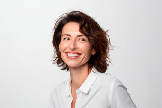 Smiling Happy Woman In Her 40s With Short Brown Hair On A White Background. Generative AI