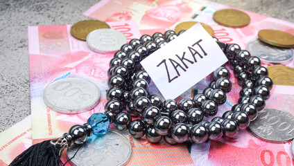 Zakat Word. Islamic zakat concept. The giving of zakat fitrah before Eid al-Fitr in the form of rice