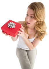 Surprised woman holding a gift