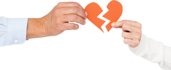 Couple holding broken heart shape paper
