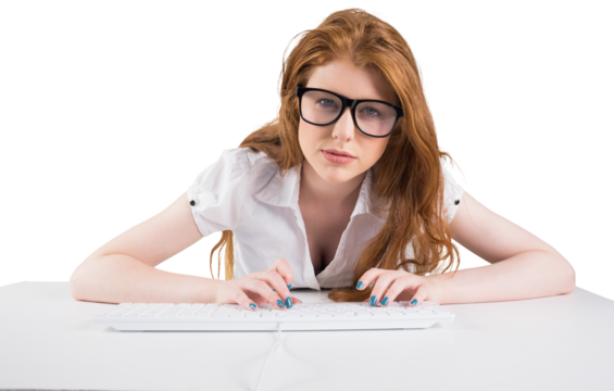 Pretty redhead typing on keyboard 