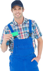 Confident plumber showing green card