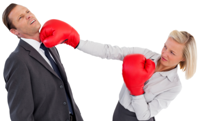 Businesswoman hitting colleague with her boxing gloves