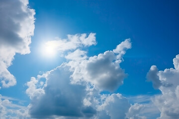 Blue sky background with white clouds. Cumulus white clouds in the blue sky.