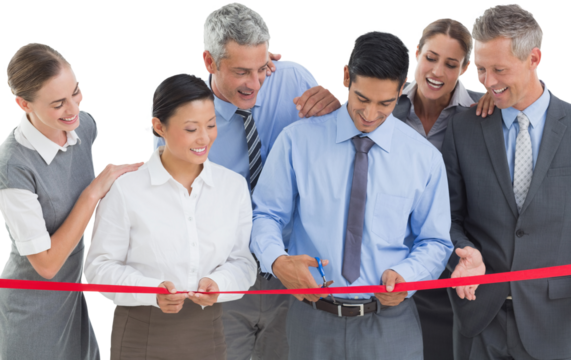 Business man cutting red strip 
