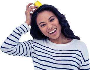 Smiling Asian woman with paper crown