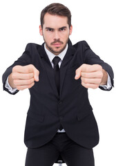Angry businessman standing with clenched fists