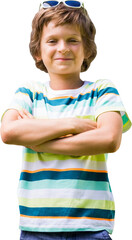 Portrait of smiling boy standing with arms crossed