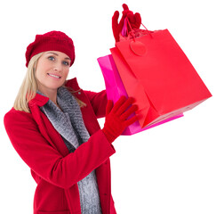 Blonde in winter clothes holding shopping bags